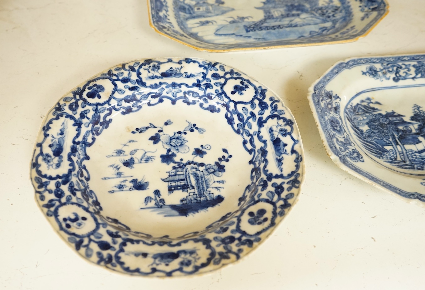 Two 18th century Chinese blue and white dishes and a similar plate, largest 29cm